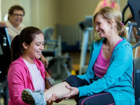 Physical therapist performing therapy on a patient