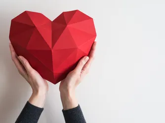 hands holding a heart-shaped object