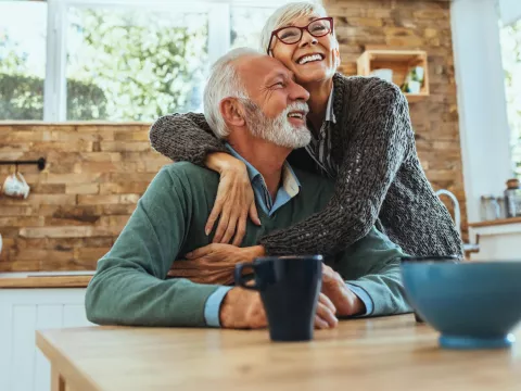 Elderly couple hugging