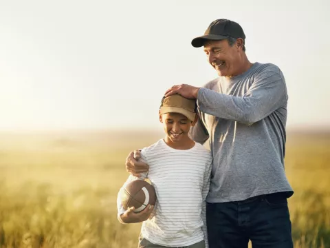Father and Son Playing Football.
