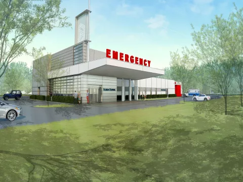 Digital rendering of the Deltona ER building mock up: a white building with the words Emergency on it surrounded by green space.