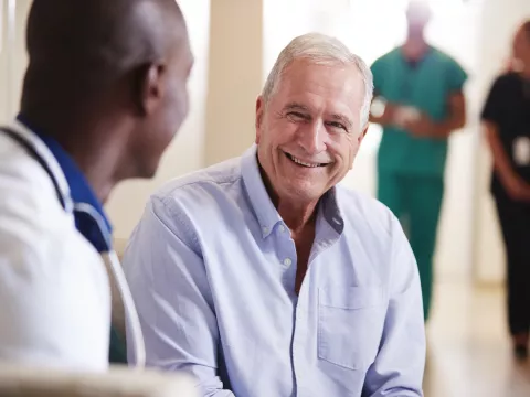 A doctor reassuring a patient.