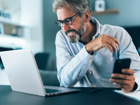 A man on his computer.