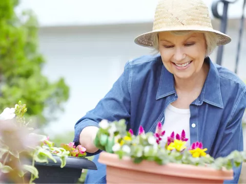A woman gardening at home.