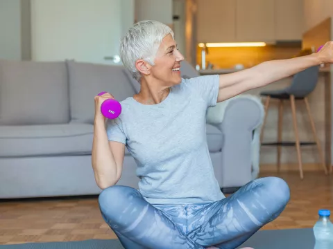 A woman exercising at home.