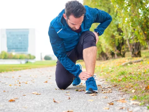 A runner kneeling down.