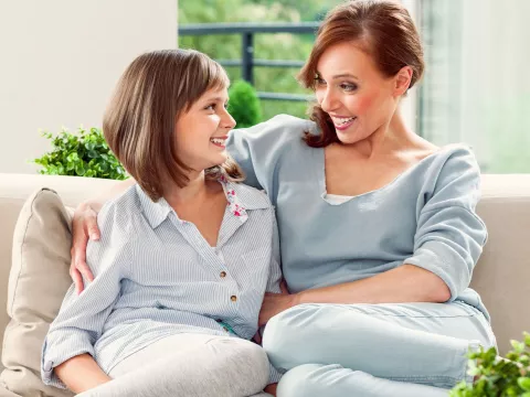 A mother comforts her daughter.