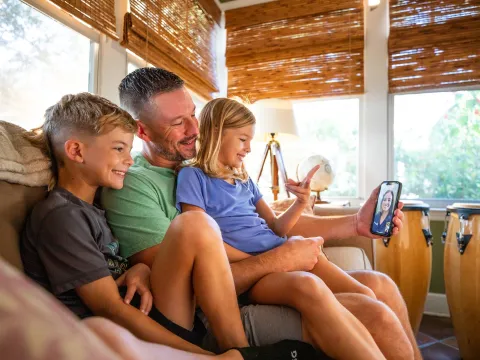 Patient and children sit during virtual visit