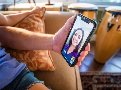 Patient on phone with nurse during virtual visit