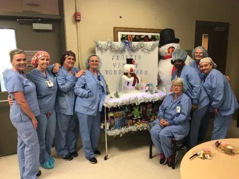 hospital employees smiling during the holidays