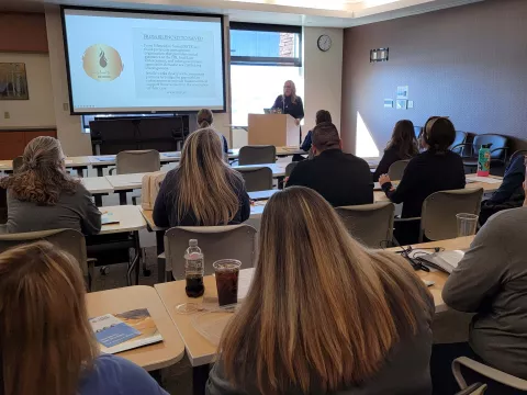 Nurses sit in a training session