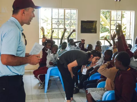 children-in-classroom-hands-raised