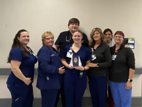 The emergency department team gathers to celebrate the 100 Top Hospital award. Left to right: April Springfield, RN, Pati Kelley, RN, Dax McKay, MD, Savannah Nix, RN, Tammy Bagley, RN, Yolanda Moyer, RN, and Rebecca Cline, PCT.
