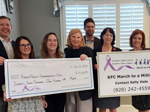 Kenmure Fights Cancer presents check to AdventHealth Hendersonville Foundation.