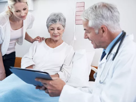 A doctor explains the procedure to a kidney transplant patient