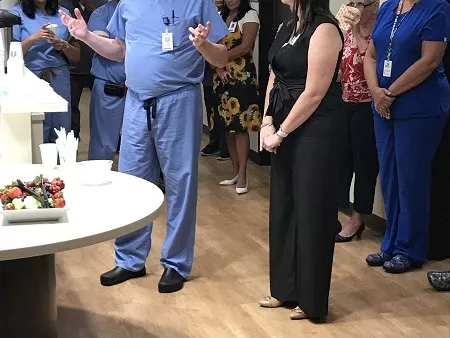 physician giving speech to group of people