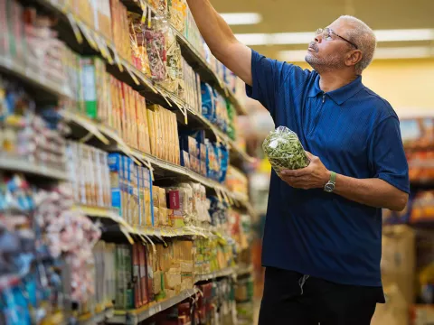 Man at the supermarket shopping for food