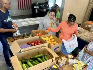 Team members volunteer at Mobile Market 2 Go