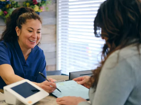Patient checking in at doctor's office.