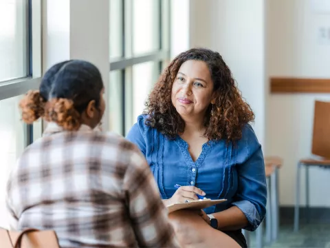 Two women having a conversation about mental health.