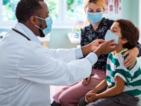 Mom and son in doctor's office