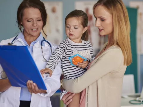 Mom and daughter with doctor