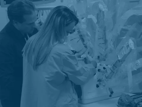 Professional using a robotic surgery system.