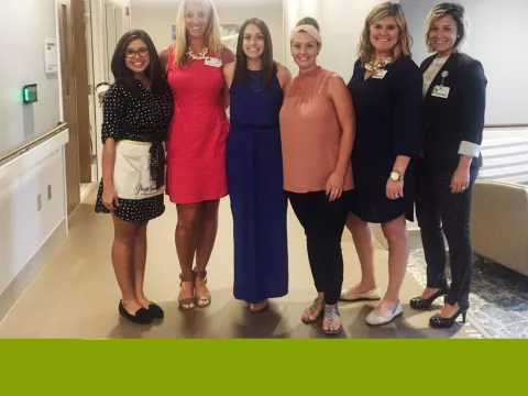 A group of women posing for a photo.