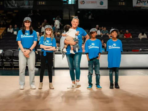 Orlando Valkyries fans standing on the court