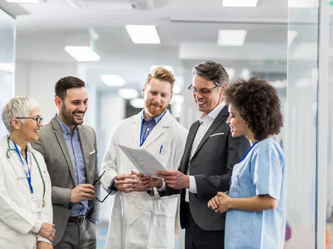 Pharmacists and care team collaborating