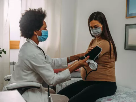 A woman getting a test done by her doctor