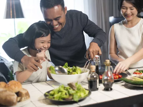 A family makes a meal together