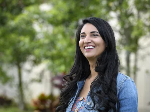Happy woman looking upward and smiling.