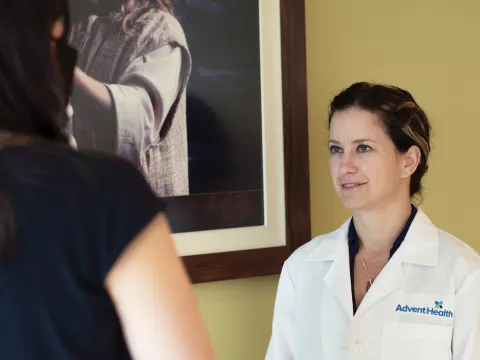 Sally Smalley, MD, examines a patient