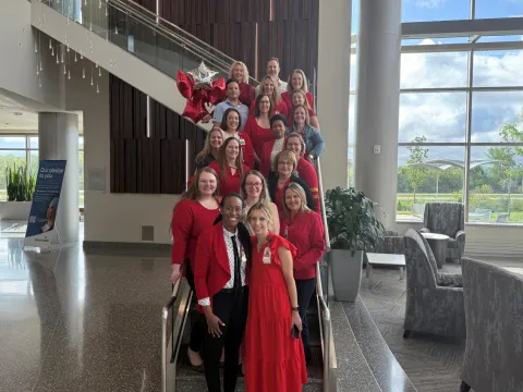 Team photo of people wearing red