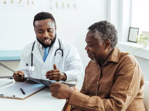 Older man talking to his doctor