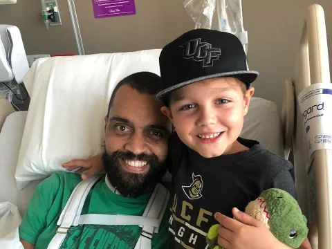 Brandon in the hospital with his son