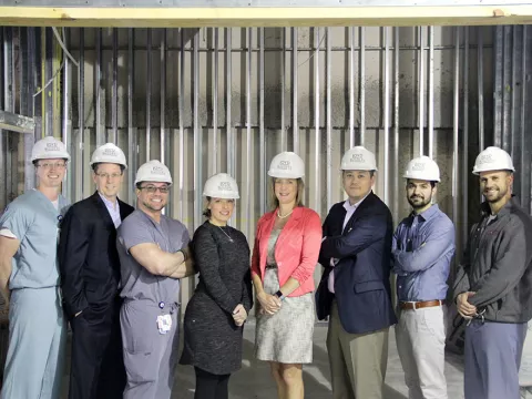 AdventHealth employees posing at a construction site