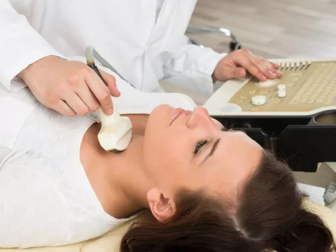 woman getting ultrasound on next