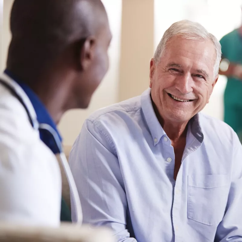 A doctor reassuring a patient.