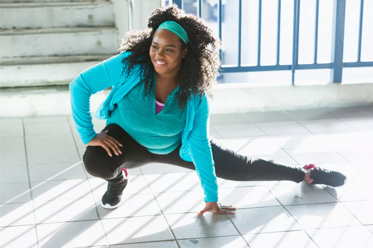 A Woman Stretches Before Going For a Run