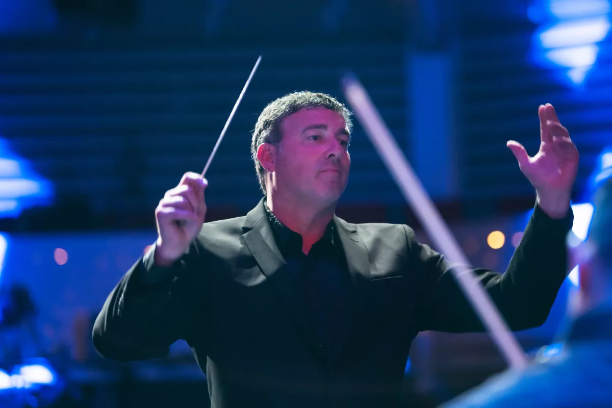 Richard Hickam conducts the AdventHealth employee orchestra.