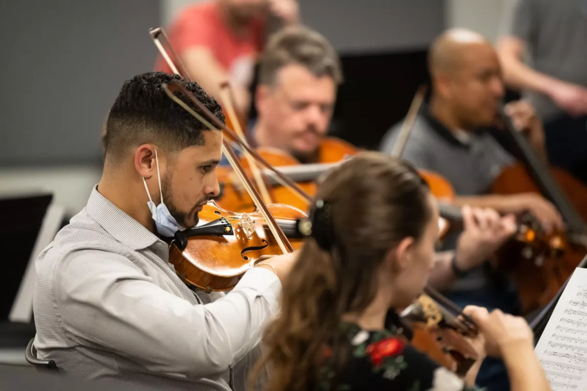 Director saw orchestra as the perfect way to bring team members together during a dark time.