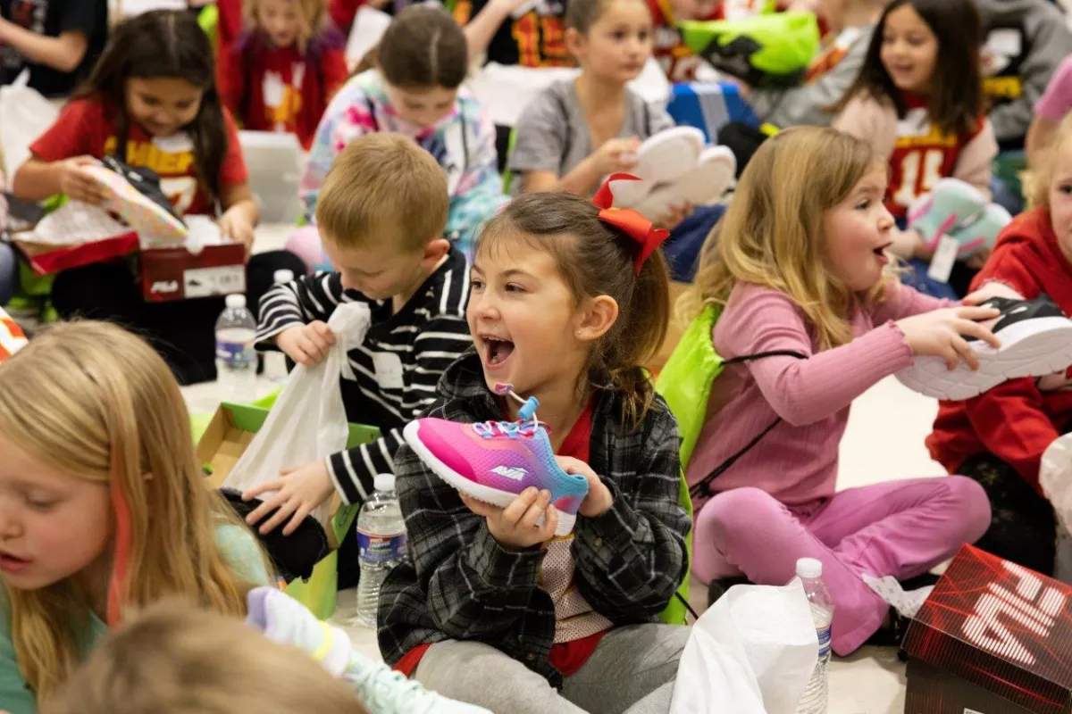 Little girls with a new pair of shoes.