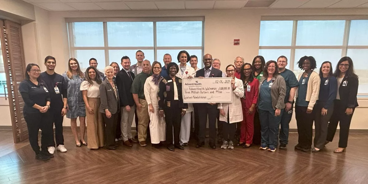 AdventHealth Waterman team members gather for the check presentation.