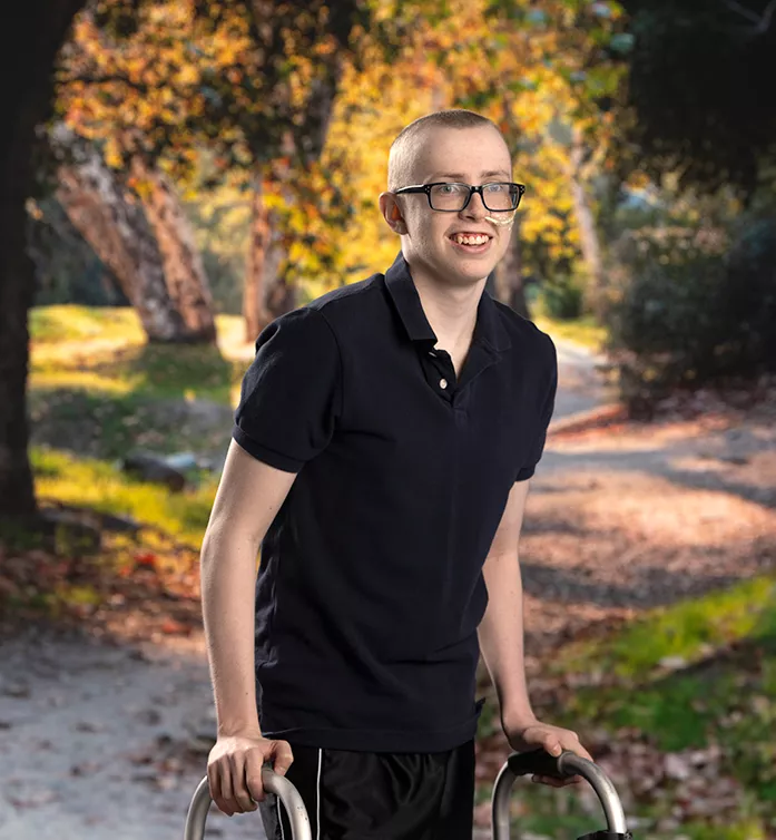 a photo of a boy with a walker