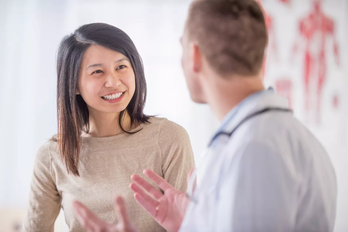 Patient talking with her doctor.