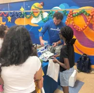 A man shows a child an experiment