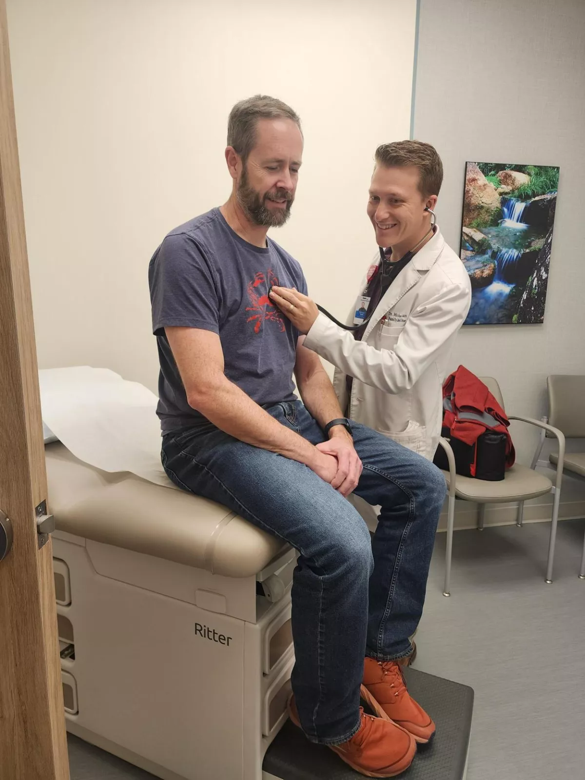 Dr. Michael Yuan with a Patient