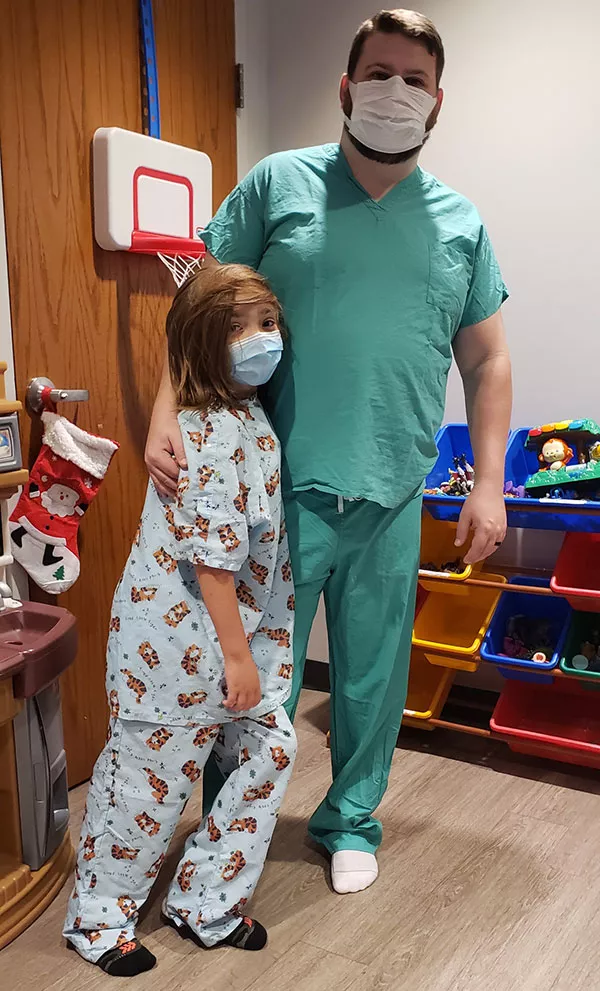 a young boy with a medical professional